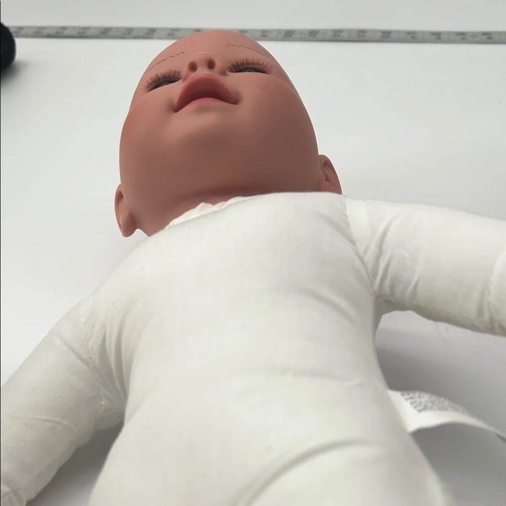 Realistic Baby Doll with White Outfit